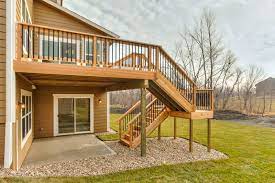 Custom Designed Cedar Deck With U Shaped Stairs And Landing Returning To Concrete Patio Deck Staircase Deck Stairs Cedar Deck