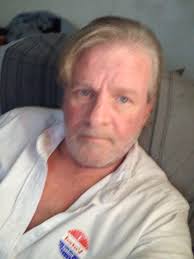 Who is the unknown woman in the family photo?