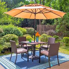 Beige Umbrella And Rattan Chairs