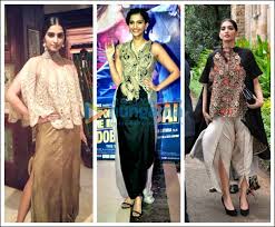 Style Seal Sonam S Recent Obsession With Anamika Khanna Bollywood News Bollywood Hungama Bollywood actress sonam kapoor in a white draped dhoti saree paired up with sleeveless net insert blouse with sheer net yoke and see through back by tarun tahiliani at kuch dil ne kaha album launch.