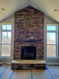 bucktown ledgestone with noir stain in 2021 fireplace decor home decor