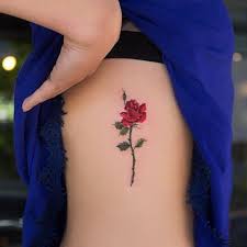 27 Inspiring Rose Tattoos Designs Coloured Rose Tattoo Rib Tattoo Rose Tattoos For Women