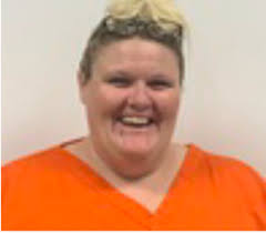 Woman accused of cruelty to animals and exploitation of an elderly victim