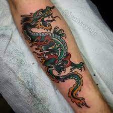 Discover The Meaning Behind Sailor Jerry S Famous Old School Tattoos From Dragon Tattoos To Classic Skull Ta Tatouage Japonais Tatouage Japonais Bras Tatouage