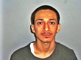 Two men charged with slaying in Pittsfield; third suspect at large