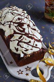 This particular pudding is actually a dense, moist cake flavored with nutmeg and cinnamon, orange marmalade, and of course lots of figs. Chocolate Loaf Cake Decorated With Whipped Cream Frosting And Stock Photo Picture And Royalty Free Image Image 112476869