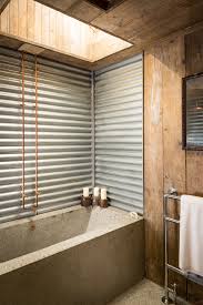 An oversized map pops against the emerald wall, while new tiles and fixtures pull the look together. 66 Cool Rustic Bathroom Designs Digsdigs