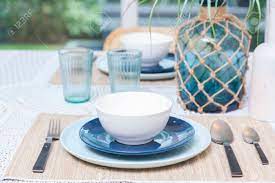 But is expanded and developed. Rustic Table Setting With Blue Plate Cutlery And Glass Vase In Home Dinning Room Stock Photo Picture And Royalty Free Image Image 119350354
