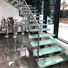 Designed to bridge a large vertical distance by dividing it into smaller vertical distances, called steps. Glass And Stainless Steel Staircase Design Model