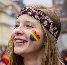 A Smiling Laughing Girl Attending the Gay Pride Parade Also Known As Christopher  Street Day CSD in Munich, Germany. Editorial Stock Image