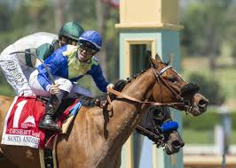 Umberto Rispoli rides Desert Dawn to Santa Anita Oaks win