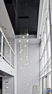 A Gorgeous Extra Long Chandelier And A High Gloss Black Stretch Ceiling Do Justice To This Gorgeous Moder Modern Chandelier Long Ceiling Lights Long Chandelier