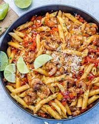 This baked tomato pasta recipe is made with tomato sauce, feta cheese, eggs, fresh basil, vegetables, and a bunch of delicious spices. Delicious Cajun Shrimp Pasta Recipe Healthy Fitness Meals