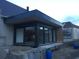Extension Ossature Bois A Toit Plat Dans Le Haut Rhin Avec Bardage En Fundermax Extension Maison Bois Extension Ossature Bois Toit Plat
