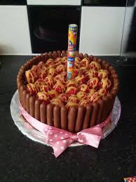 Red Velvet Cake With Chocolate Butter Cream Surrounded By Cadbury Finger Biscuits Loaded With Raspberries In The Middle Drizzled With White Chocolate Butters