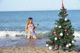 Check spelling or type a new query. Woman On Christmas At The Beach In The South With Christmas Tree Stock Photo Picture And Royalty Free Image Image 108498140