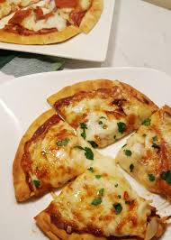 Place the pita bread in a pie tin. Air Fryer 6 Minute Pita Bread Cheese Pizza This Old Gal