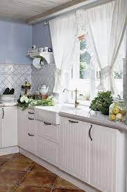 We have a huge selection of quality, easy to hang kitchen curtains that are sure to enhance your décor. Home In The Countryside Inspiring Interiors Country Kitchen Curtains Kitchen Curtain Designs White Kitchen Curtains