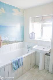 It ties in perfectly with all of your seashells, white accent pieces, and knotted creations. Oh I Do Like To Be Beside The Seaside A Thrifty Beach Hut Bathroom Makeover Beach Hut Bathroom Coastal Bathroom Design Nautical Bathroom Design Ideas