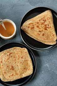 2 Square Parathas In A Platter 2 Triangle Parathas In A Platter And A Silver Bowl Of Ghee Food Sandwich Recipes Indian Recipes