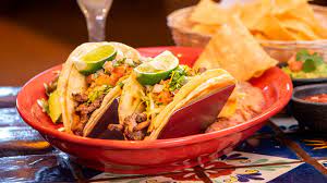 Giant shrimp wrapped with bacon and topped with cheese. For The Love Of Tacos San Joaquin Magazine