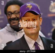 Minnesota Vikings running back Chuck Foreman, 44, drags along Buffalo Bill  Ed Jones, 26, as he nears the goal line in Buffalo, New York