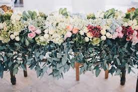 Spring wedding flower trends include fresh greens like ferns, dusty miller, and baby's breath mixed with all white flowers such as roses, calla lilies, and astilbe to create an organic, romantic feel. Ibiza Wedding Flower Trends 2018 Ibiza Wedding Guide Getting Married On Ibiza