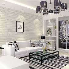 Rather than opting for all black and whites, the anchor pieces—like sofa and tables—remain neutral while the throws, artwork and lamp. White Grey Real Looking Brick Pattern Wallpaper Wp120 Brick Wallpaper Living Room Brick Living Room Wallpaper Living Room