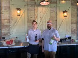 Hey everyone it is a beautiful day at Triple 3 Vineyard! Meet Zach and  Aaron…they are serving it up in our Silo Bar. Melissa and Daniel are  setting up and getting ready