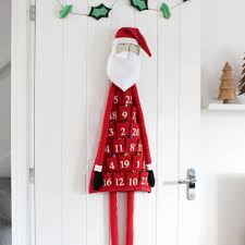 Hot chocolate topped with a swirl of whipped cream, sprinkled with spice, in a white china cup and saucer. Diy Paper Christmas Village Advent Calendar Free Printable Template Mindy