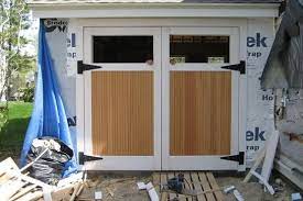 Use of these types of fasteners will greatly reduce the life of your real carriage garage doors. Swing Out Garage Doors How To Build In Three Steps Home Interiors Garage Doors Barn Style Garage Doors Wooden Garage Doors