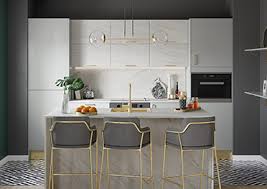 A glamorous white ceiling, walls, and cabinets contrast with the dark wood of the kitchen island. Kitchens Fitted Kitchen Ranges Uk Magnet