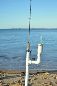 A rod and reel are secure in a rod holder. Ultimate Fishing Rod Holder Fish Fishing Tips Saltwater Fishing