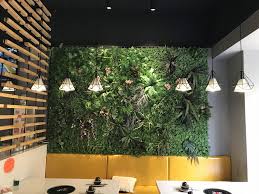 Check This Restaurant Interior Green Wall Decoration Idea Fully Represent The Concept Of Nature And Green To Cus Green Wall Design Green Wall Decor Green Wall