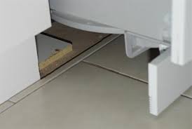 should you tile under bathroom vanities