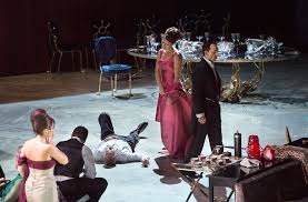 After dinner, the guests retire to the salon to socialize. Viridiana Luis Bunuel The Last Supper Scene Simanaitis Says