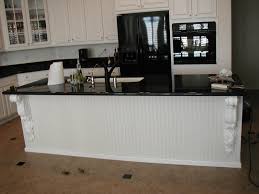 black cabinets with white appliances