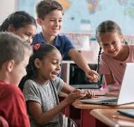 "School: Kids Laughing At Funny Online Video" by Stocksy Contributor "Sean  Locke"