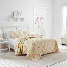 The country porch features the yellow toile quilt, pillow sham and bedding accessories from c&f enterprises. Laura Ashley Melany Ruffled Yellow Quilt And Coordinating Sham Separates On Sale Overstock 30650421