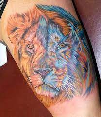 Colored Lion Tattoo Great Use Of Blue As A Contrasting Color For Shading Lion Tattoo Lion Tattoo Designs Tattoos For Guys