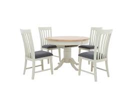 How big should a round table be to accomodate 8 chairs and diners? Angeles Round Extending Dining Table And 4 Wooden Dining Chairs Furnitureland Furniture Village