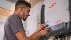 Person checking an inverter for problems