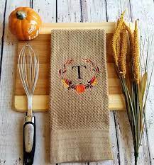 Tan Kitchen Towel With Fall Wreath Monogram Etsy In 2021 Monogram Wreath Monogram Towels Fall Wreath