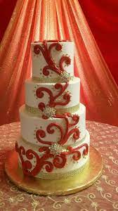 Whimsical Wedding Cake Colors Red And Beige With Gold Accessories Buttercream Icing On Four Round Tiers Wedding Cake Red Whimsical Wedding Cakes Cake