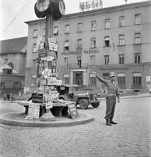 A Us Military Policeman Directs Traffic At A Crossroads Passau Germany September 1945