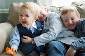 When buying a sofa, the first thing to do is to measure your space and the sofa to make sure they fit with each other. Cheerful Brothers Wearing Suits While Sitting On Sofa At Home During Easter Celebration Stockphoto