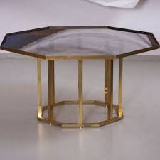 We even have coffee tables that can turn into dining tables with just a few simple motions. Large Octagonal Coffee Table In Massive Brass From Maison Jansen 1960s For Sale At Pamono
