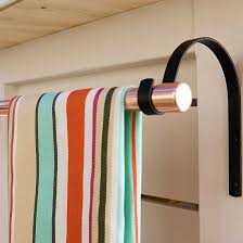 Save up on space in your bathroom cabinet and gain vertical storage while giving your bathroom wall decor an elegant look with this classy, timeless piece. Outdoor Storage Solutions Towel Rack Pool Pool Towel Storage Pool Towels