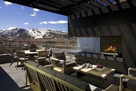 A cold, dark, piece of property can become warm and inviting with the addition of a backyard fireplace. Sizzling Style How To Decorate A Stylish Outdoor Hangout With A Fireplace