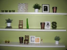 A fresh take on wall decor, moving away from the usual vintage grandeur towards more modern designs filled with colors, scripts, and geometrical patterns. Living Room Design Wall Shelf Ideas Novocom Top